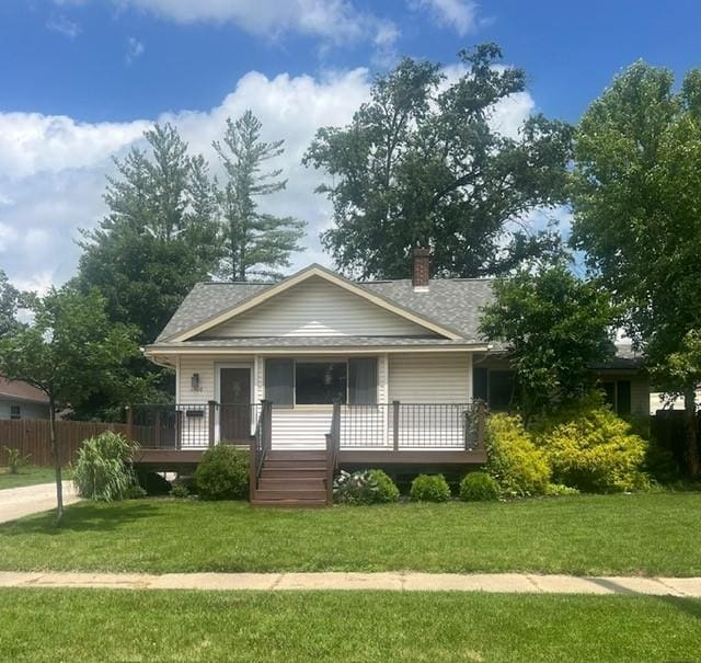 1506 Main St, Adel, IA 50003 - view of front facade featuring a chimney and roof with shingles