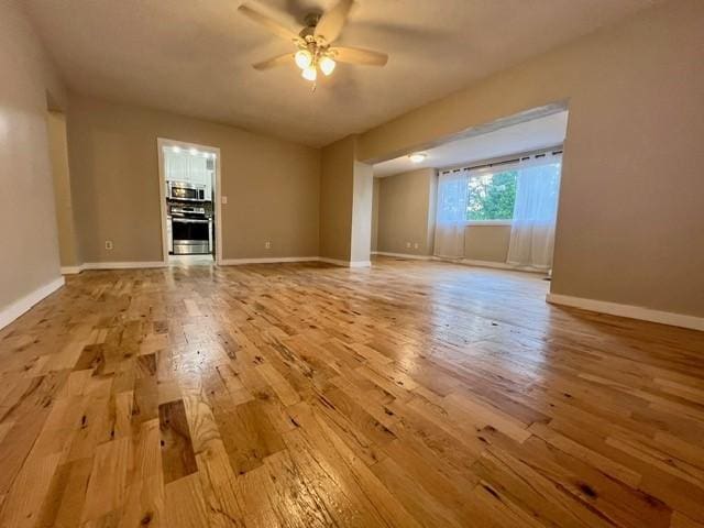 1506 Main St, Adel, IA 50003 - unfurnished room with light wood-style flooring and ceiling fan