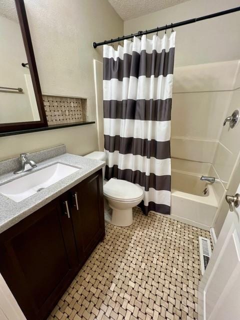 1506 Main St, Adel, IA 50003 - bathroom with a textured ceiling, vanity, and shower / bath combination with curtain