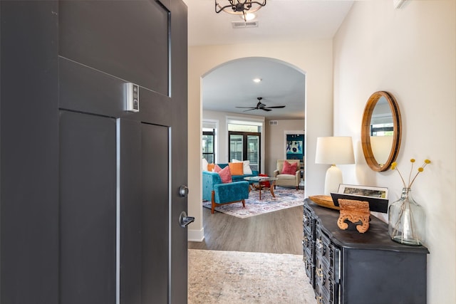 2930 Green Hills Dr, Ames, IA 50014 - entrance foyer with arched walkways, wood finished floors, and ceiling fan