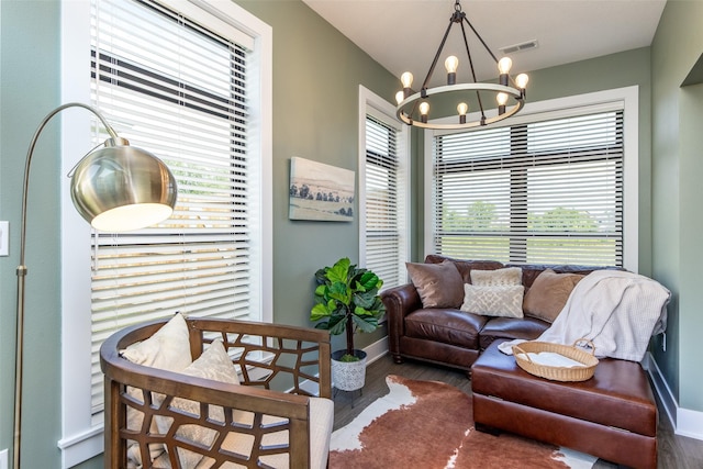 2930 Green Hills Dr, Ames, IA 50014 - living room with wood finished floors, a chandelier, and healthy amount of natural light
