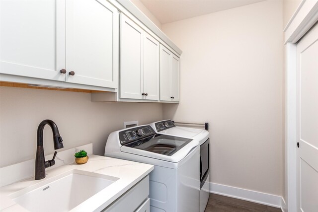 2930 Green Hills Dr, Ames, IA 50014 - laundry room featuring washer and dryer, cabinet space, and dark wood finished floors