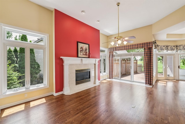 1069 Glen Oaks Dr, West Des Moines, IA 50266 - unfurnished living room featuring a high ceiling, a high end fireplace, a ceiling fan, and wood finished floors