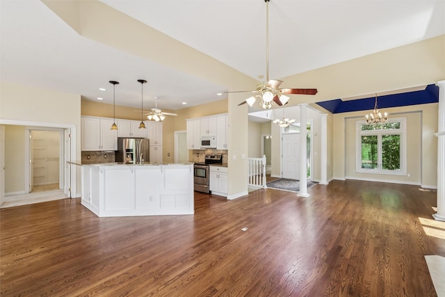1069 Glen Oaks Dr, West Des Moines, IA 50266 - kitchen featuring appliances with stainless steel finishes, a chandelier, tasteful backsplash, white cabinetry, and recessed lighting