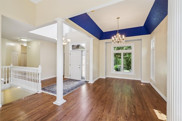 1069 Glen Oaks Dr, West Des Moines, IA 50266 - entrance foyer with a chandelier, wood finished floors, and ornate columns