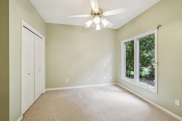 1069 Glen Oaks Dr, West Des Moines, IA 50266 - unfurnished bedroom with carpet floors, a closet, and a ceiling fan