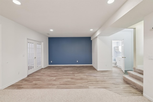 1069 Glen Oaks Dr, West Des Moines, IA 50266 - empty room featuring recessed lighting, light wood-style floors, stairway, and french doors