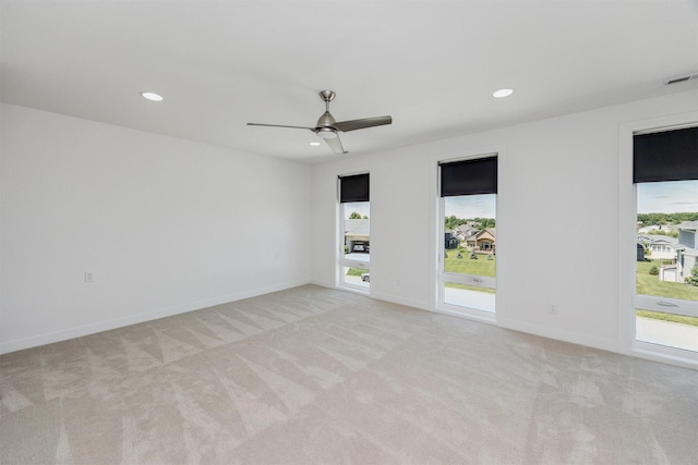 989 65th St, West Des Moines, IA 50266 - empty room with light colored carpet, recessed lighting, and ceiling fan
