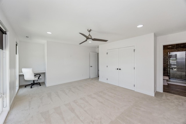 989 65th St, West Des Moines, IA 50266 - unfurnished bedroom featuring carpet flooring, recessed lighting, ensuite bath, a closet, and a ceiling fan