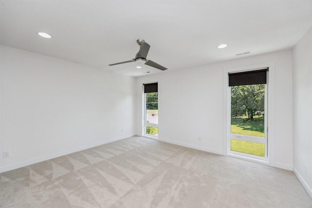 989 65th St, West Des Moines, IA 50266 - spare room featuring light carpet, recessed lighting, and a ceiling fan