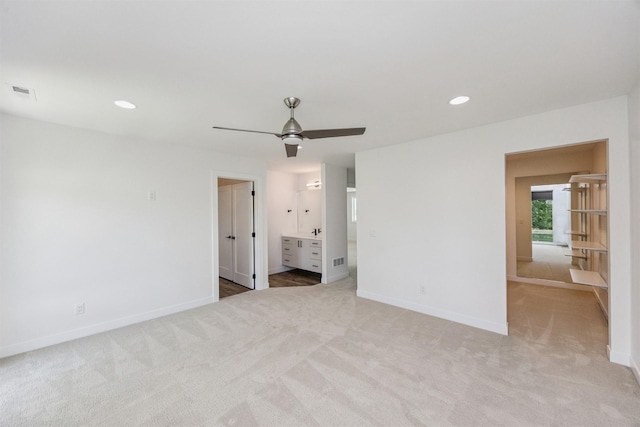 989 65th St, West Des Moines, IA 50266 - empty room with light carpet, a ceiling fan, and recessed lighting