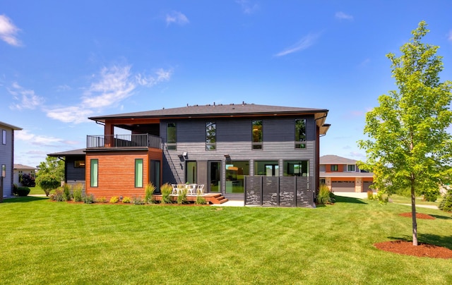 989 65th St, West Des Moines, IA 50266 - rear view of house with a balcony and a yard