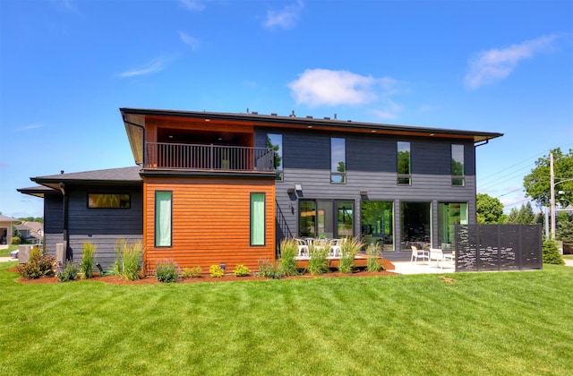 989 65th St, West Des Moines, IA 50266 - back of house with a patio area, a yard, and a balcony