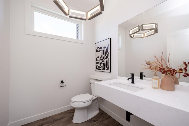 989 65th St, West Des Moines, IA 50266 - bathroom featuring a sink and wood finished floors