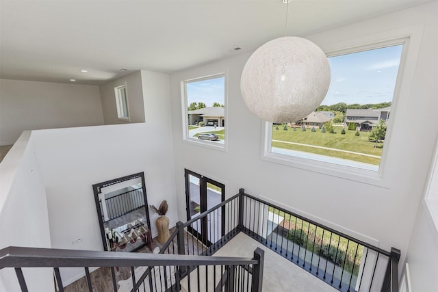 989 65th St, West Des Moines, IA 50266 - staircase featuring carpet floors