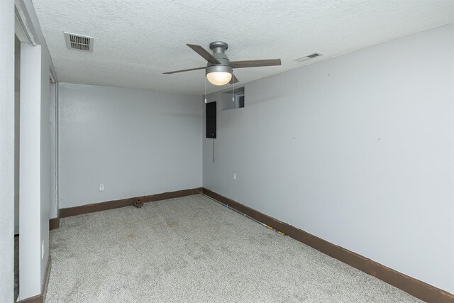 2421 Adams Ave, Des Moines, IA 50310 - empty room with carpet flooring, a ceiling fan, and a textured ceiling