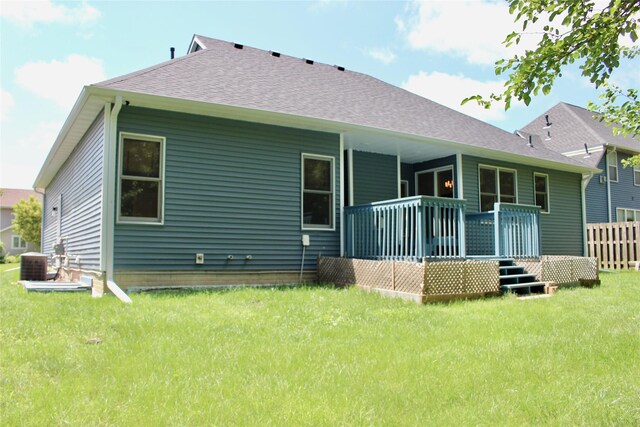 4015 Marigold Dr, Ames, IA 50014 - back of property featuring a lawn, roof with shingles, and a deck