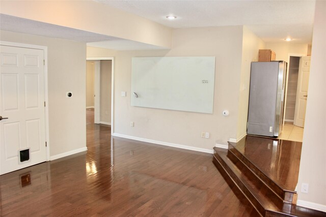 4015 Marigold Dr, Ames, IA 50014 - unfurnished living room with wood finished floors and baseboards