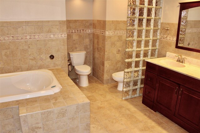 4015 Marigold Dr, Ames, IA 50014 - full bath featuring tile walls, a garden tub, vanity, tile patterned flooring, and a bidet