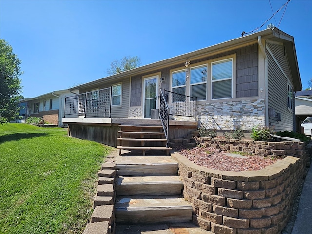 2612 Grandview Ave, Des Moines, IA 50317 - view of front facade with a front lawn and stone siding
