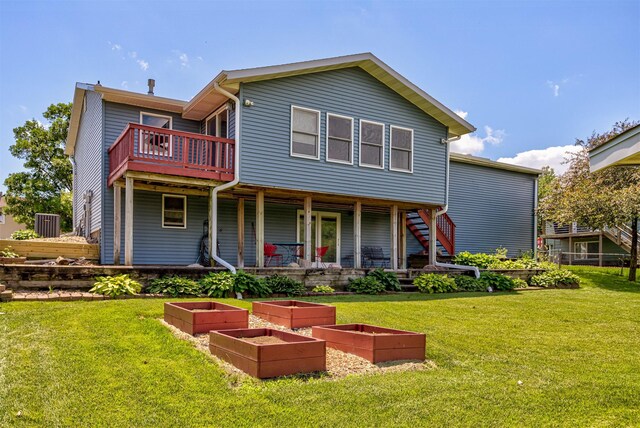 503 E 5th St, Huxley, IA 50124 - rear view of house with a vegetable garden and a lawn