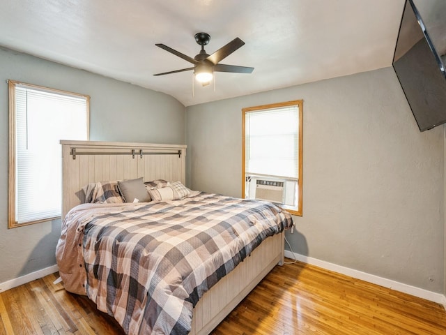 3504 27th St, Des Moines, IA 50310 - bedroom featuring cooling unit, wood finished floors, and ceiling fan