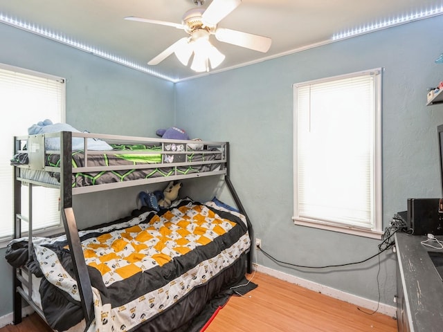 3504 27th St, Des Moines, IA 50310 - bedroom with wood finished floors and ceiling fan