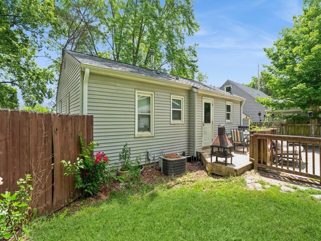 3504 27th St, Des Moines, IA 50310 - rear view of house featuring a wooden deck and a shingled roof