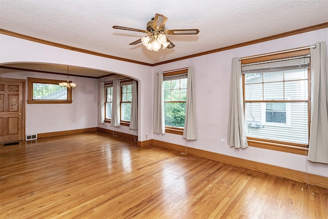 317 N Russell Ave, Ames, IA 50010 - unfurnished room with arched walkways, light wood finished floors, a chandelier, a textured ceiling, and a ceiling fan