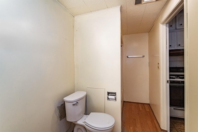 317 N Russell Ave, Ames, IA 50010 - bathroom featuring toilet and wood finished floors