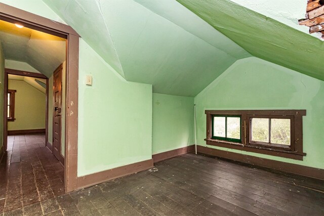 317 N Russell Ave, Ames, IA 50010 - bonus room featuring vaulted ceiling and hardwood / wood-style floors