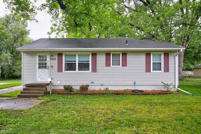 3925 55th St, Des Moines, IA 50310 - view of front facade with a front lawn and roof with shingles
