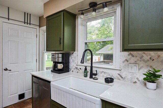 3925 55th St, Des Moines, IA 50310 - kitchen with green cabinets, dishwasher, light countertops, and backsplash