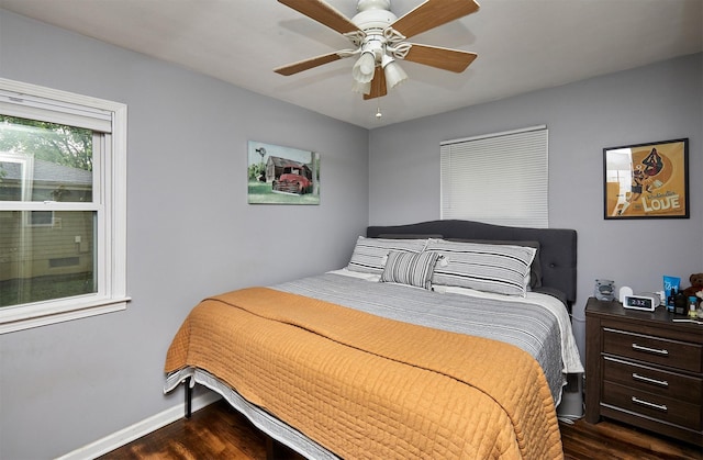 3925 55th St, Des Moines, IA 50310 - bedroom with dark wood-type flooring and a ceiling fan