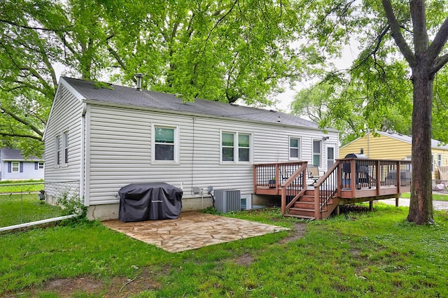 3925 55th St, Des Moines, IA 50310 - rear view of property featuring a patio, a wooden deck, and a shingled roof