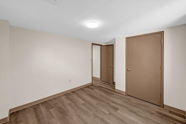 1516 73rd St, Windsor Heights, IA 50324 - unfurnished bedroom with light wood-style flooring and a closet