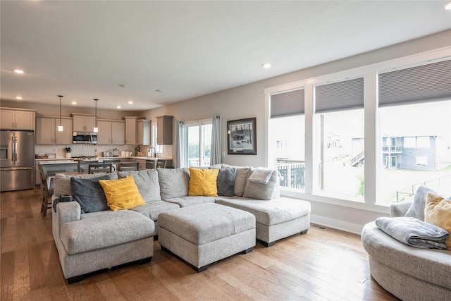 2920 Oak St, Norwalk, IA 50211 - living room featuring hardwood / wood-style floors and recessed lighting