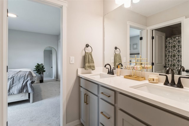 2920 Oak St, Norwalk, IA 50211 - ensuite bathroom with double vanity and baseboards