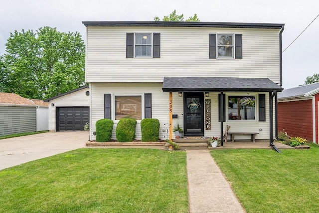 305 E 20th St S, Newton, IA 50208 - view of front of house featuring driveway and a front lawn