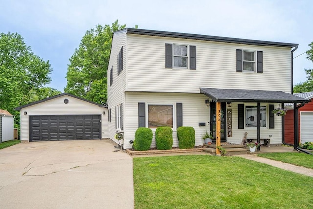 305 E 20th St S, Newton, IA 50208 - view of front of home with an outbuilding, a front yard, and a detached garage