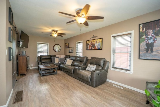 305 E 20th St S, Newton, IA 50208 - living room with ceiling fan and light wood-type flooring