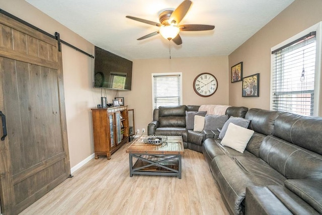 305 E 20th St S, Newton, IA 50208 - living area featuring ceiling fan, light wood finished floors, and a barn door
