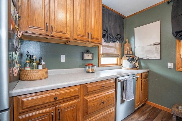 305 E 20th St S, Newton, IA 50208 - kitchen featuring brown cabinetry, dark wood finished floors, light countertops, appliances with stainless steel finishes, and crown molding