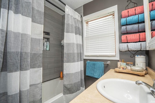 305 E 20th St S, Newton, IA 50208 - full bathroom featuring shower / bath combo, healthy amount of natural light, and vanity