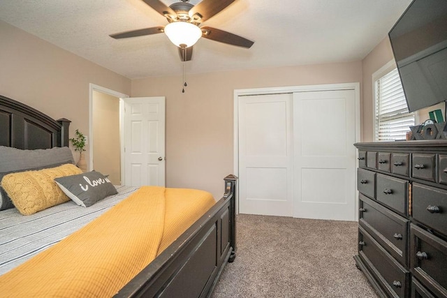 305 E 20th St S, Newton, IA 50208 - bedroom featuring light colored carpet, a closet, and ceiling fan