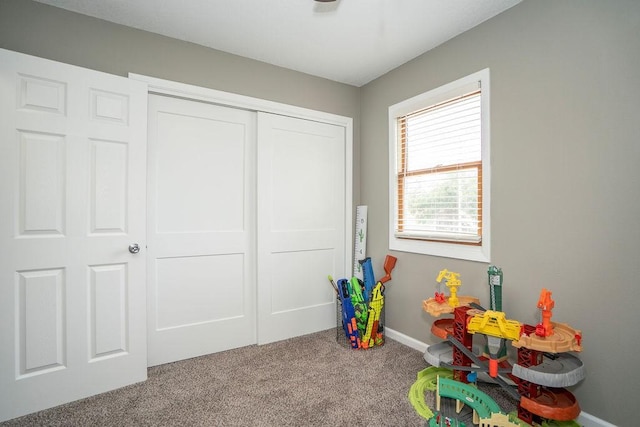 305 E 20th St S, Newton, IA 50208 - recreation room featuring carpet and baseboards