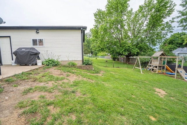 305 E 20th St S, Newton, IA 50208 - view of yard with a playground