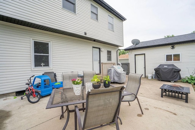 305 E 20th St S, Newton, IA 50208 - view of patio / terrace with a grill, an outdoor fire pit, and outdoor dining space