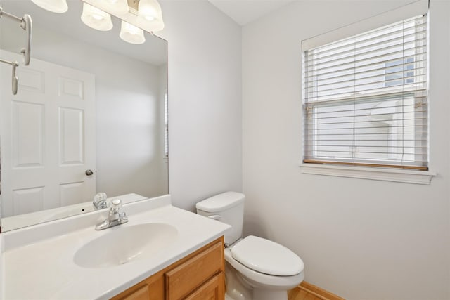 7039 Carey Ct, Johnston, IA 50131 - bathroom featuring toilet and vanity