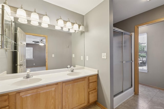 7039 Carey Ct, Johnston, IA 50131 - bathroom with double vanity, a stall shower, tile patterned floors, and ceiling fan